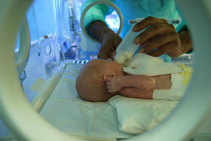 Premature Baby Bottle Feeding Inside Neonatal Incubator